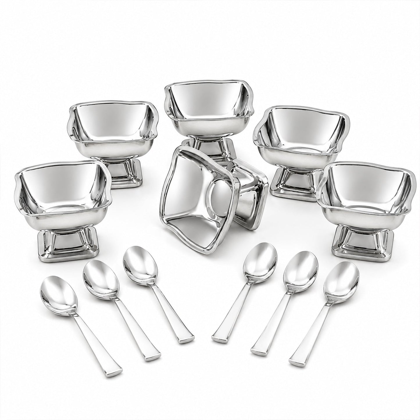 Six empty stainless steel ice cream cups and six matching spoons arranged on a white surface.