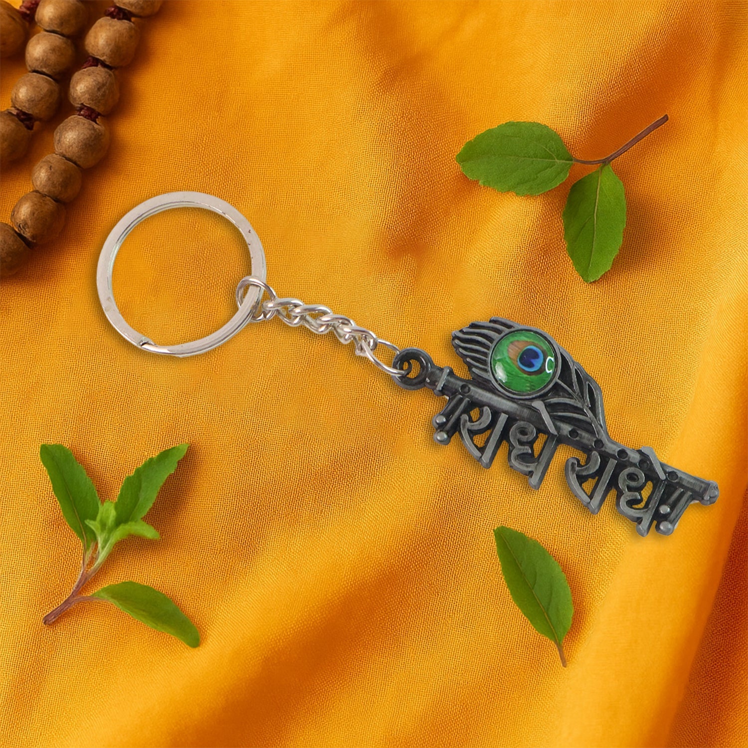 Radha Krishna metal keychain with sturdy ring and chain attached