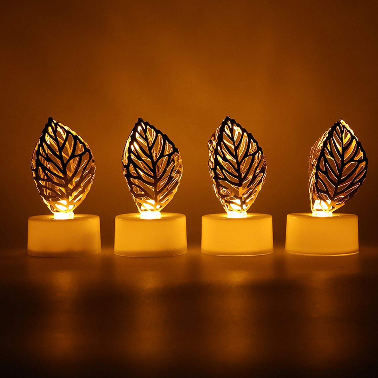 Side view of a golden leaf LED candle, demonstrating its battery compartment and on/off switch.