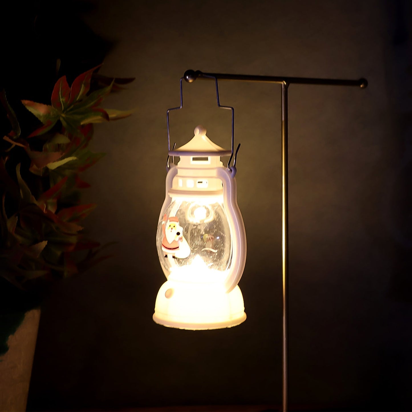 Decorative Santa LED lantern with its battery compartment visible.