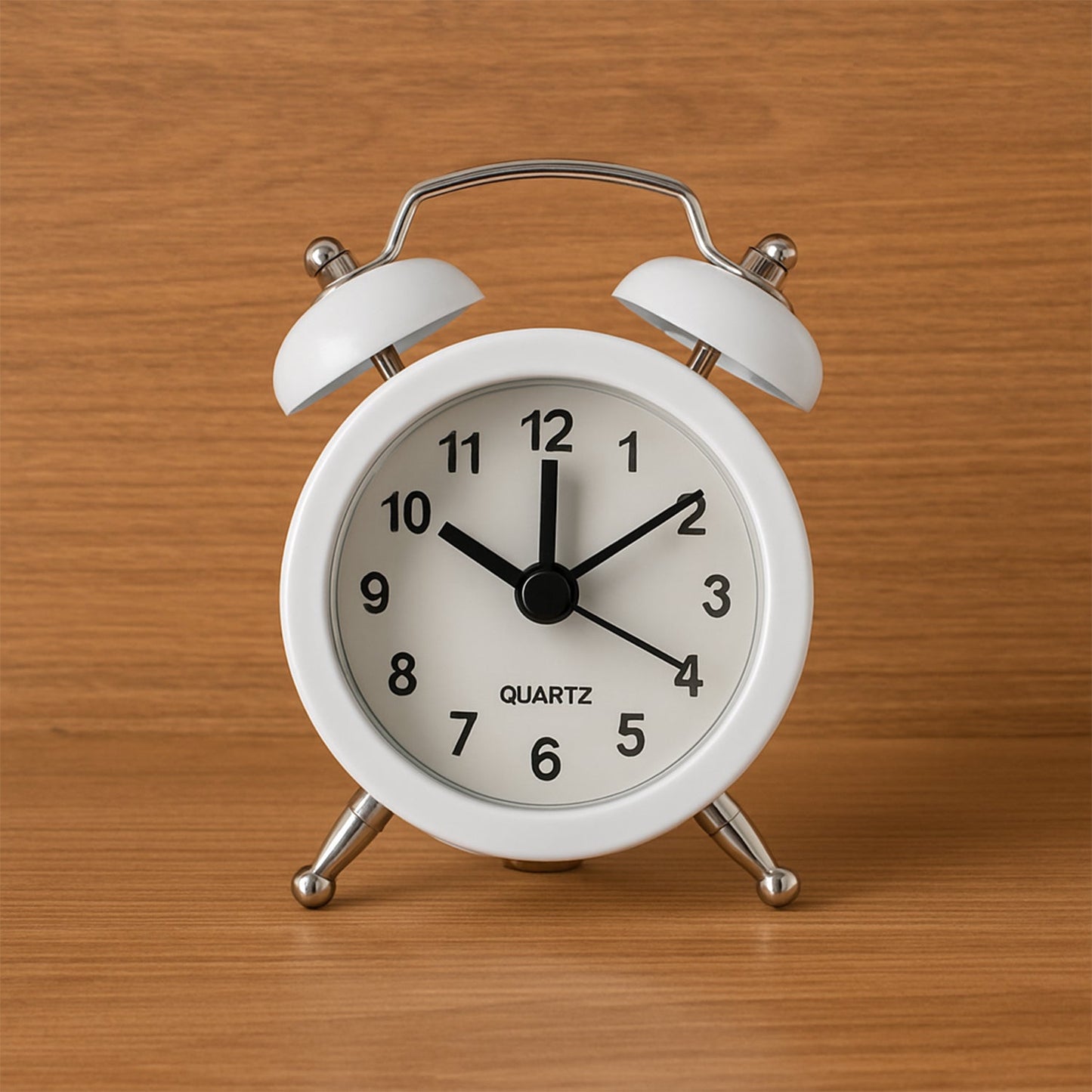 Close-up of a classic twin-bell analog alarm clock face.