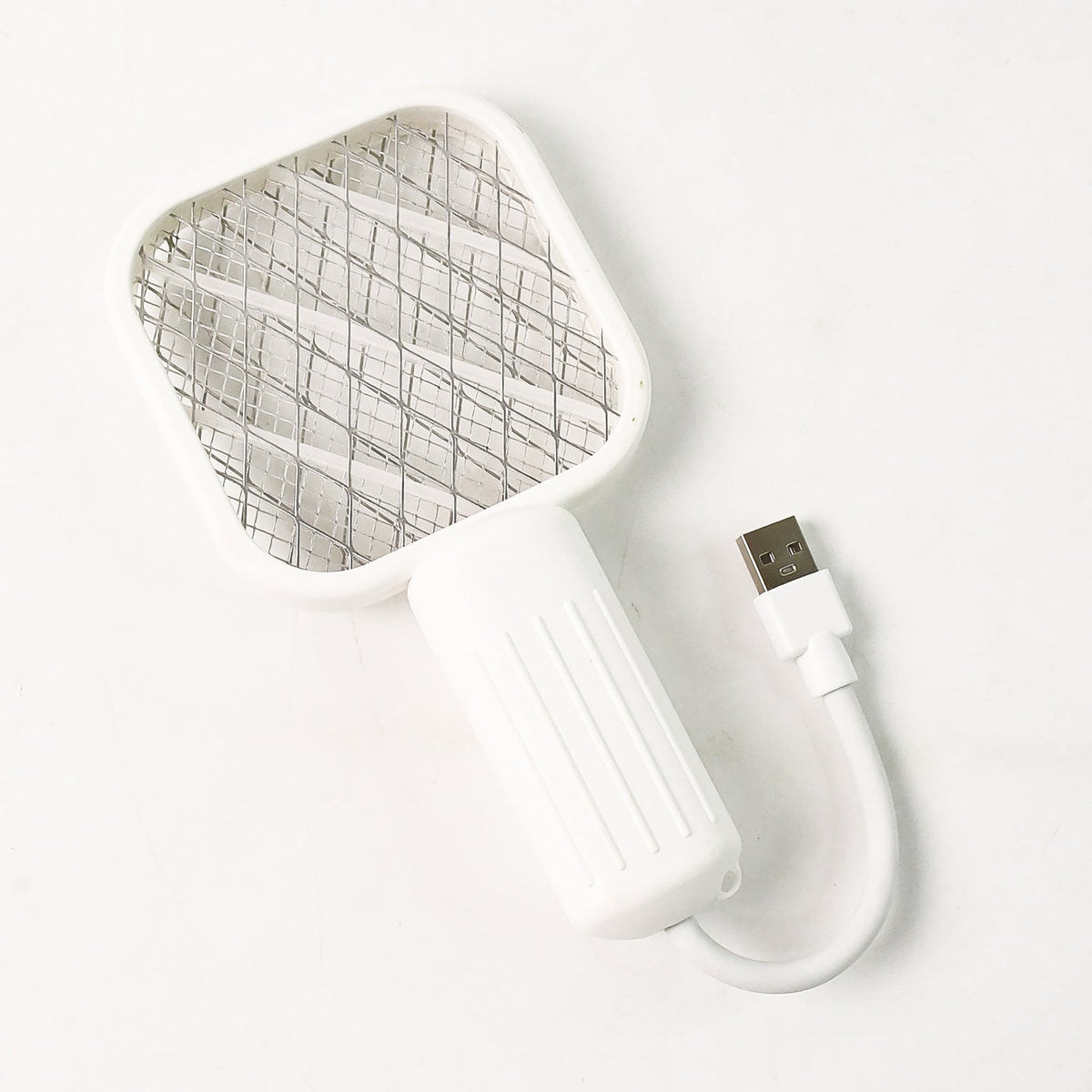 A white electric bug zapper with a square head and ribbed handle, connected to a USB cable, on a white background.