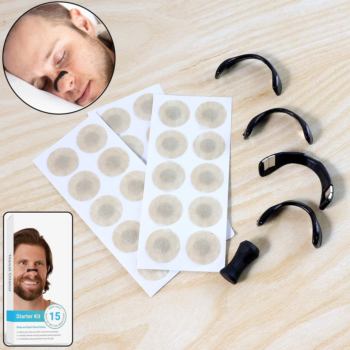 Assorted black nasal dilators and two sheets of beige circular patches on a wooden surface