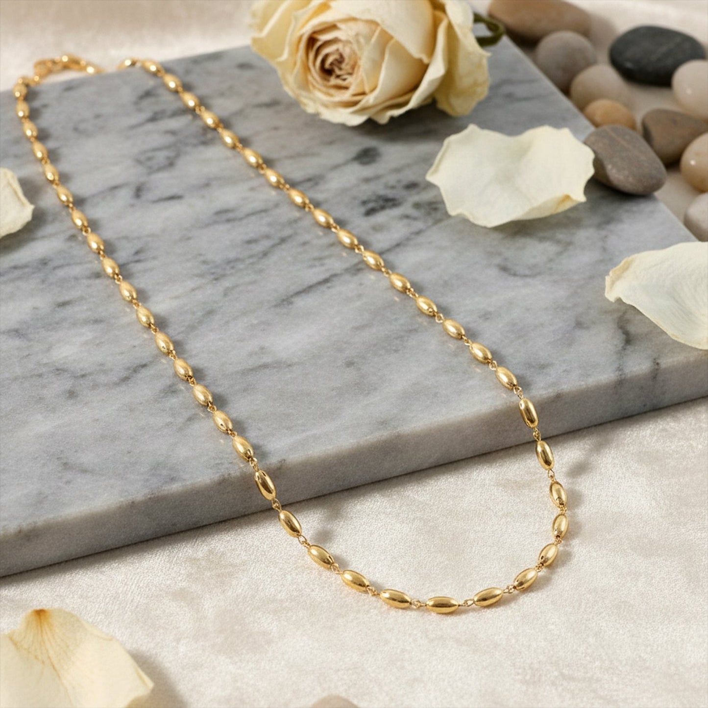 Stylish gold tone oval bead necklace suitable for office wear