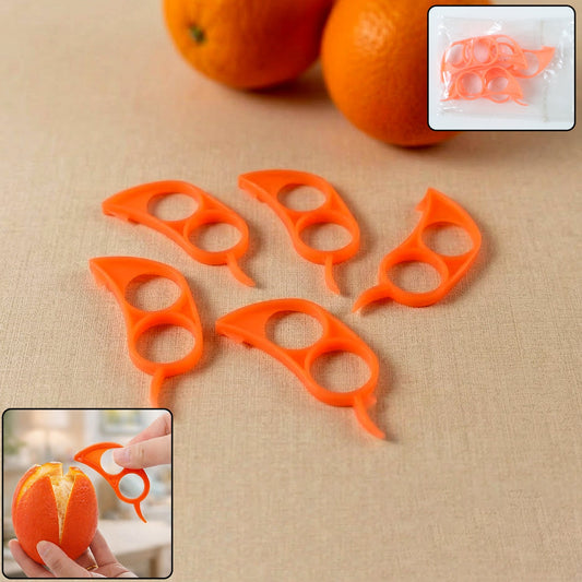 Five orange plastic citrus peelers are arranged on a light brown surface with two oranges in the background.