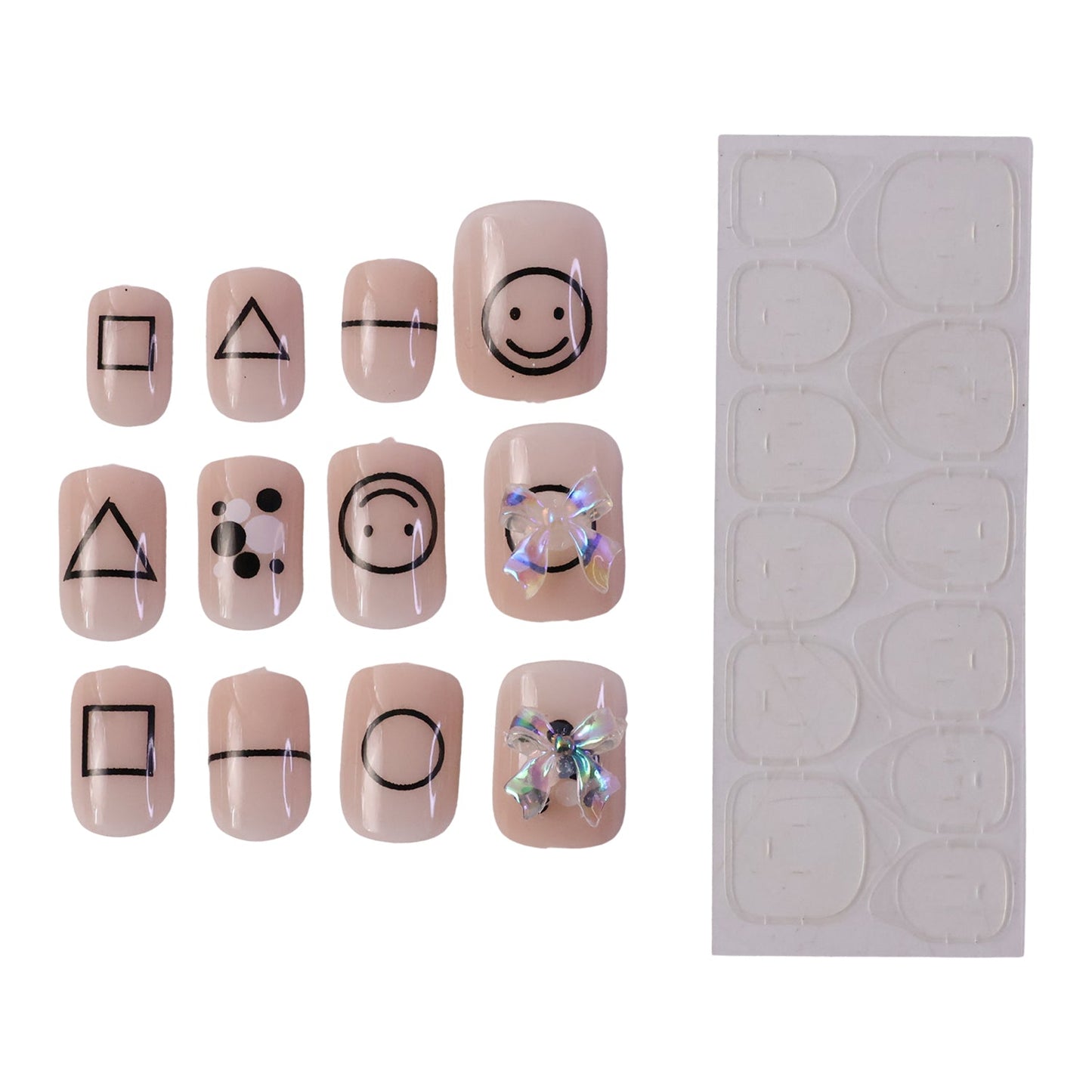 Twelve nude press-on nails with black geometric shapes and two iridescent bows, next to a sheet of clear adhesive tabs.