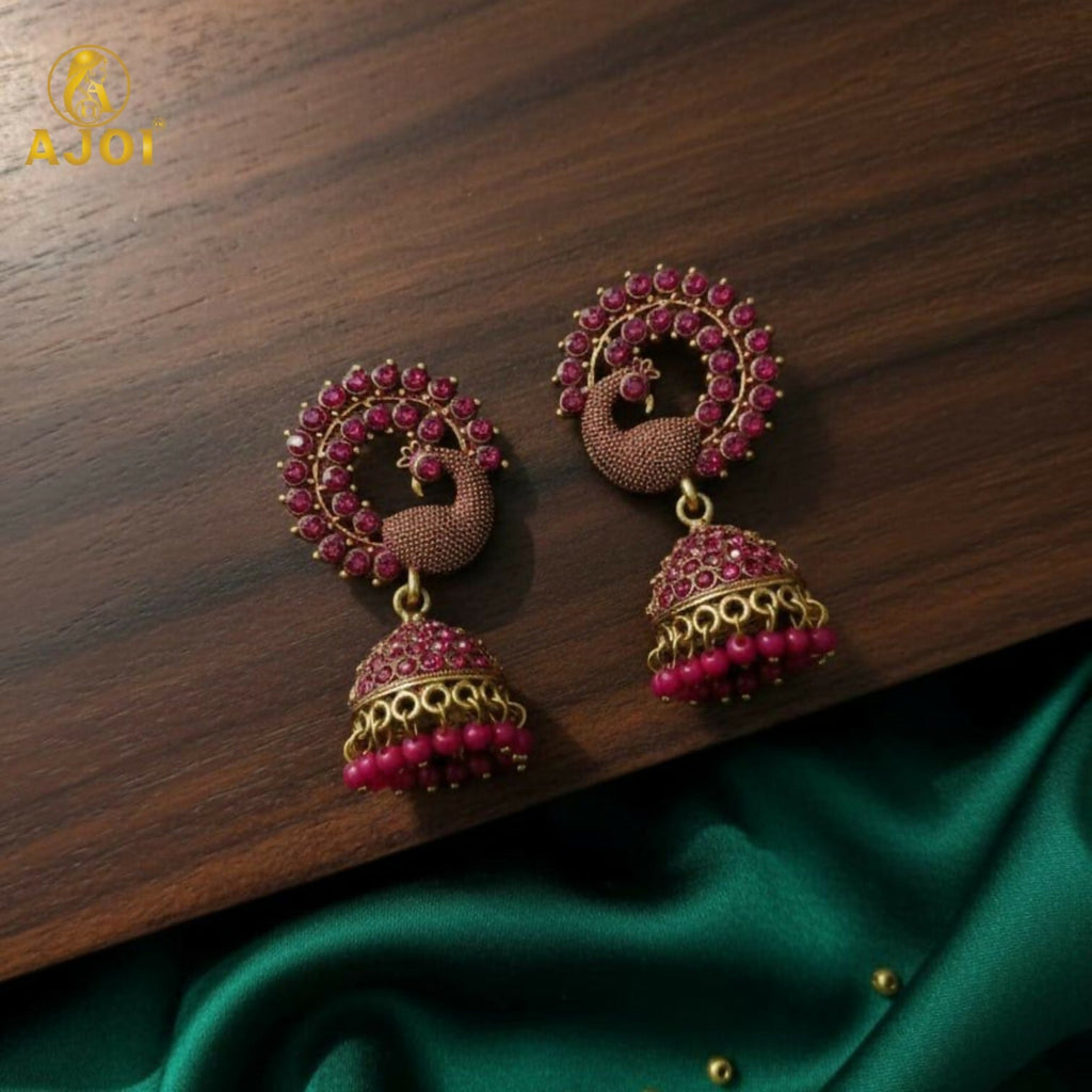 Peacock Motif Ruby-Tone Jhumka Earrings in Antique Gold Finish
