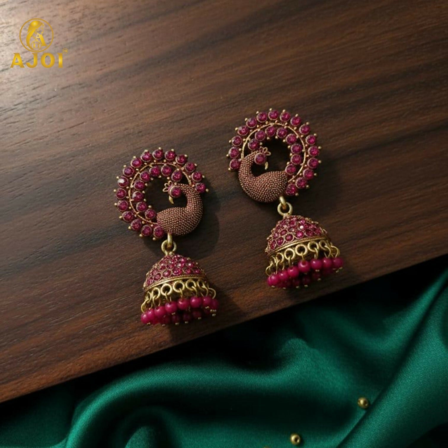 Peacock Motif Ruby-Tone Jhumka Earrings in Antique Gold Finish