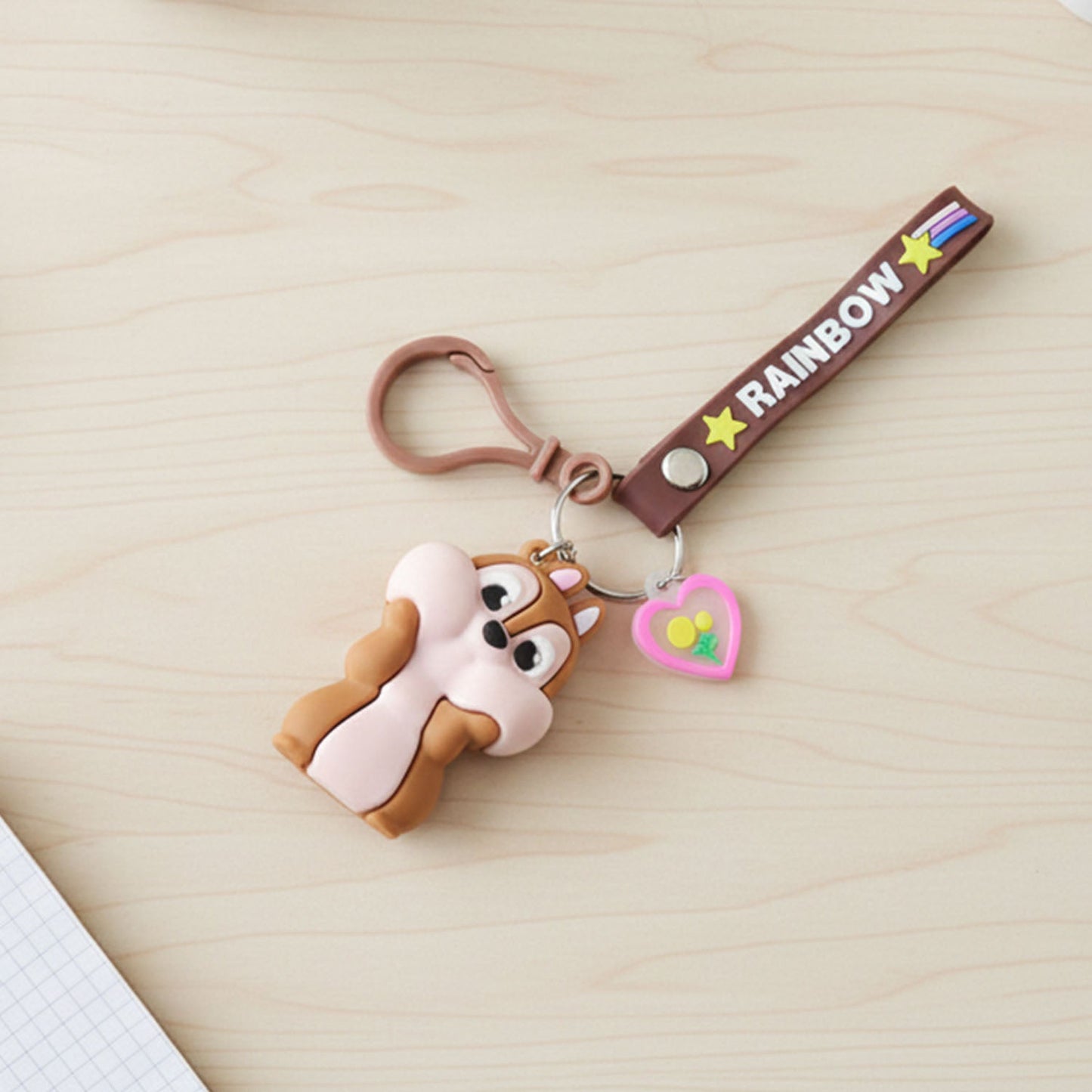 Closeup of silicone keychain strap featuring bright rainbow colours