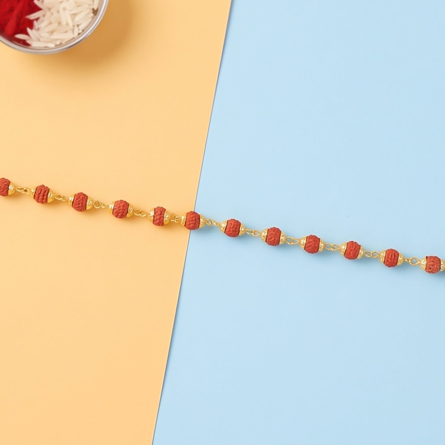 Side view of the rudraksha bead rakhi bracelet with adjustable thread.