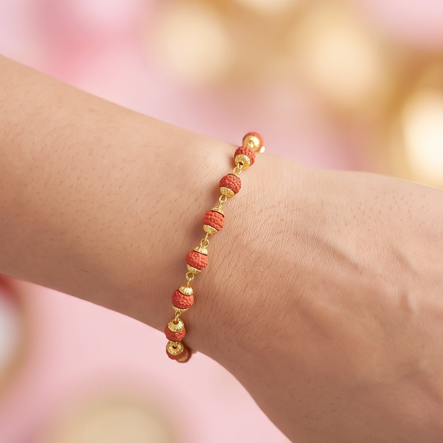 Overhead shot of the rudraksha bead rakhi alongside other festive items.