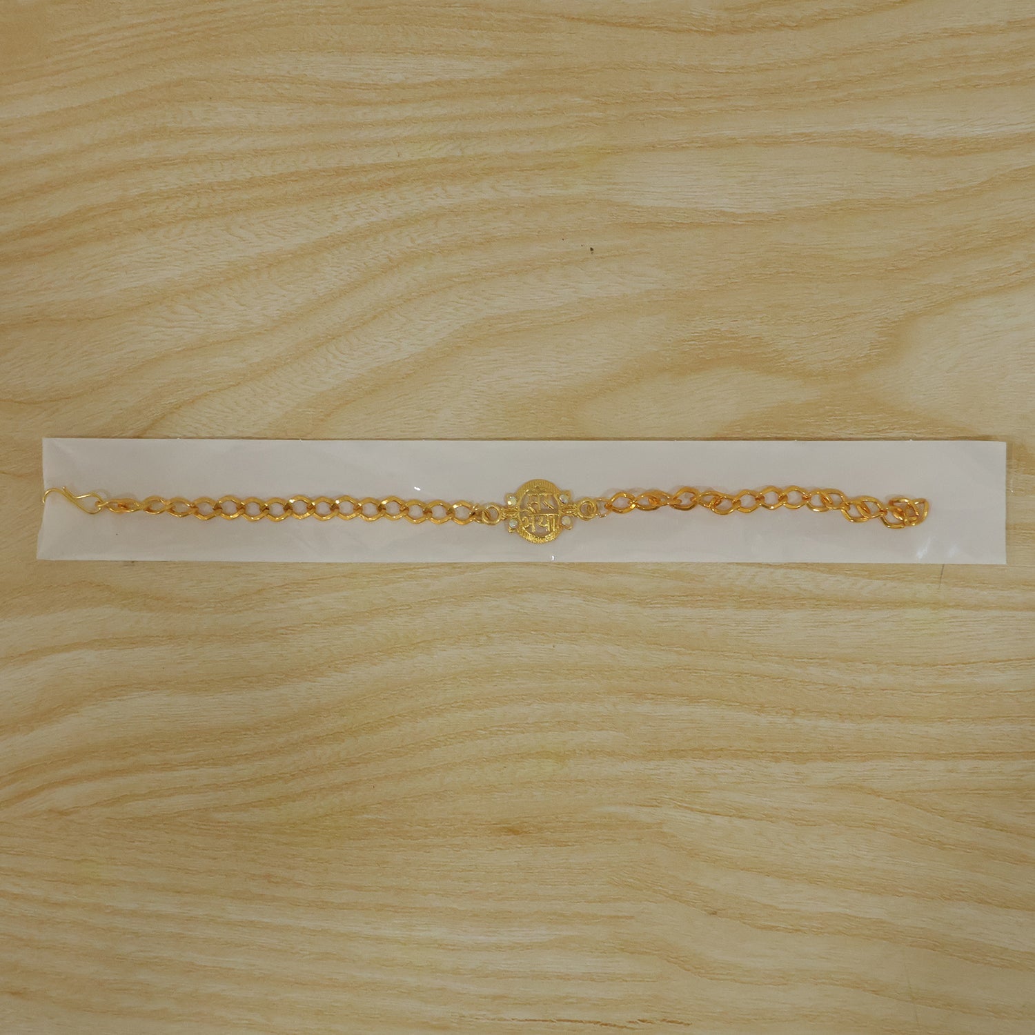 Sparkling stone details on the Mere Bhaiya gold-plated bracelet rakhi.