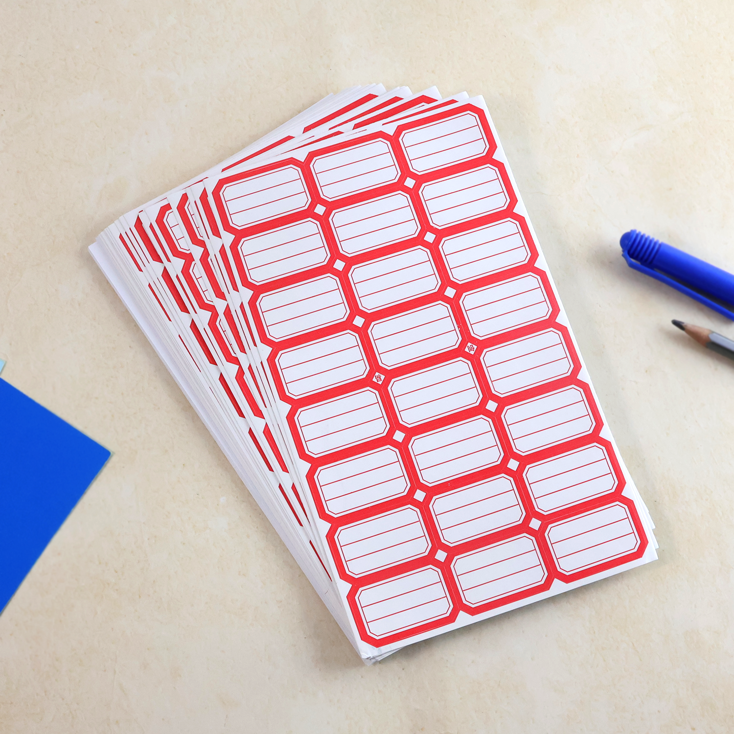 Red rectangular self-adhesive label stickers sheet close-up