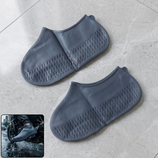 Small reusable waterproof silicone shoe covers protecting sneakers from mud.