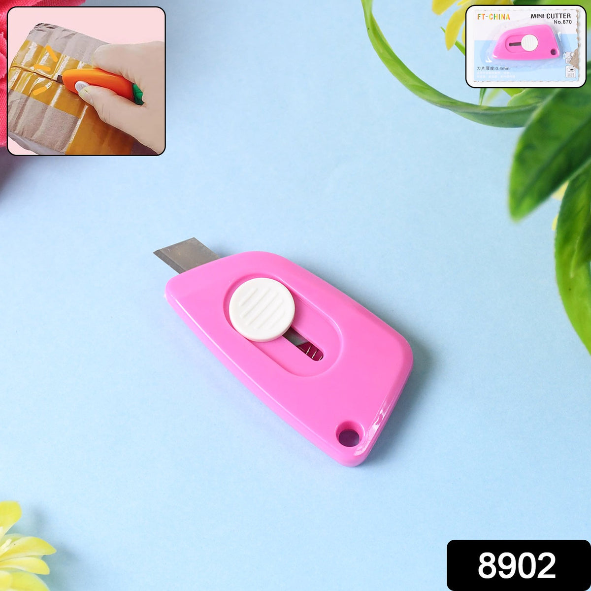 A pink retractable utility knife on a blue surface, with an inset image of it cutting a box and a product label.