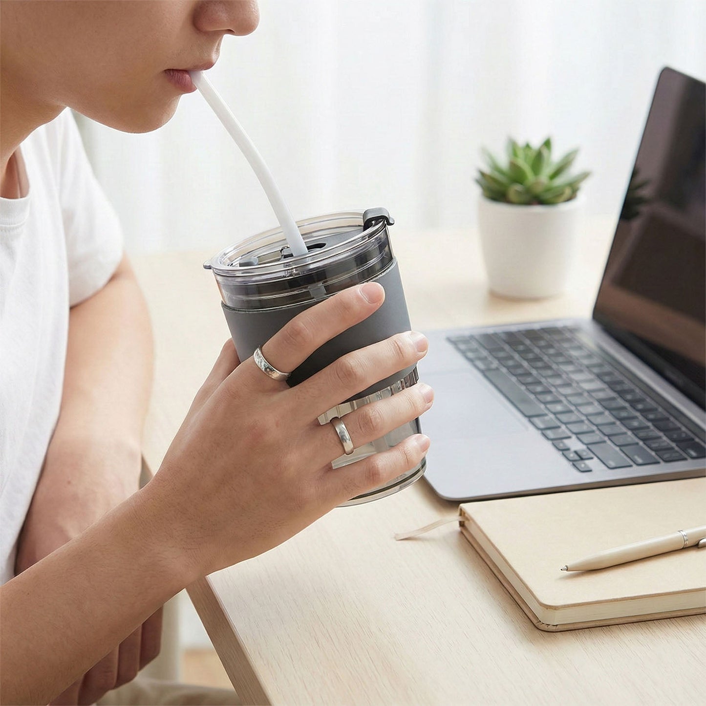 Plastic tumbler filled with a refreshing beverage, ready for use at home or office.