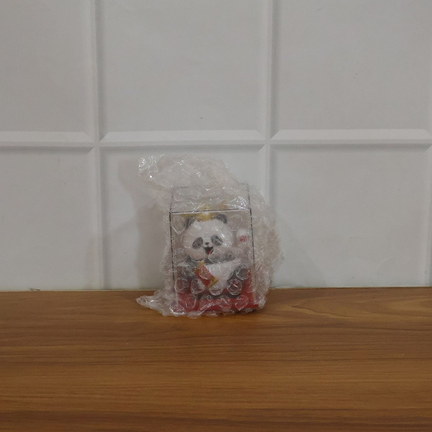 Funny moving panda collectible showing waving hand