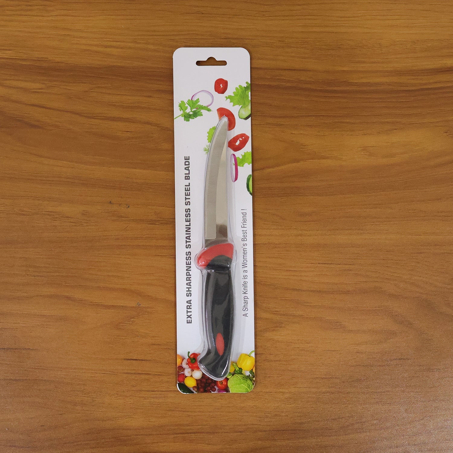 Stainless steel kitchen utility knife being used in the kitchen