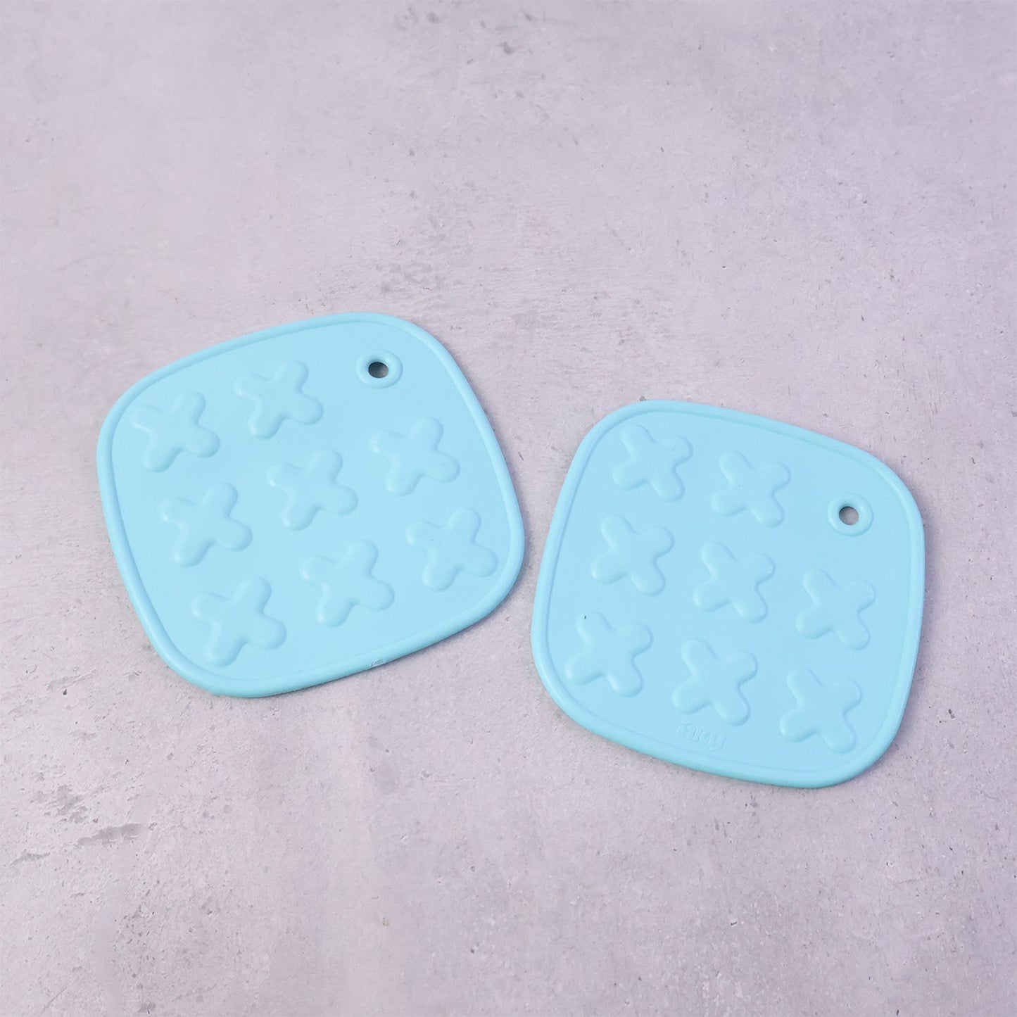 Cup coaster with secure textured non-slip surface for holding hot drinks