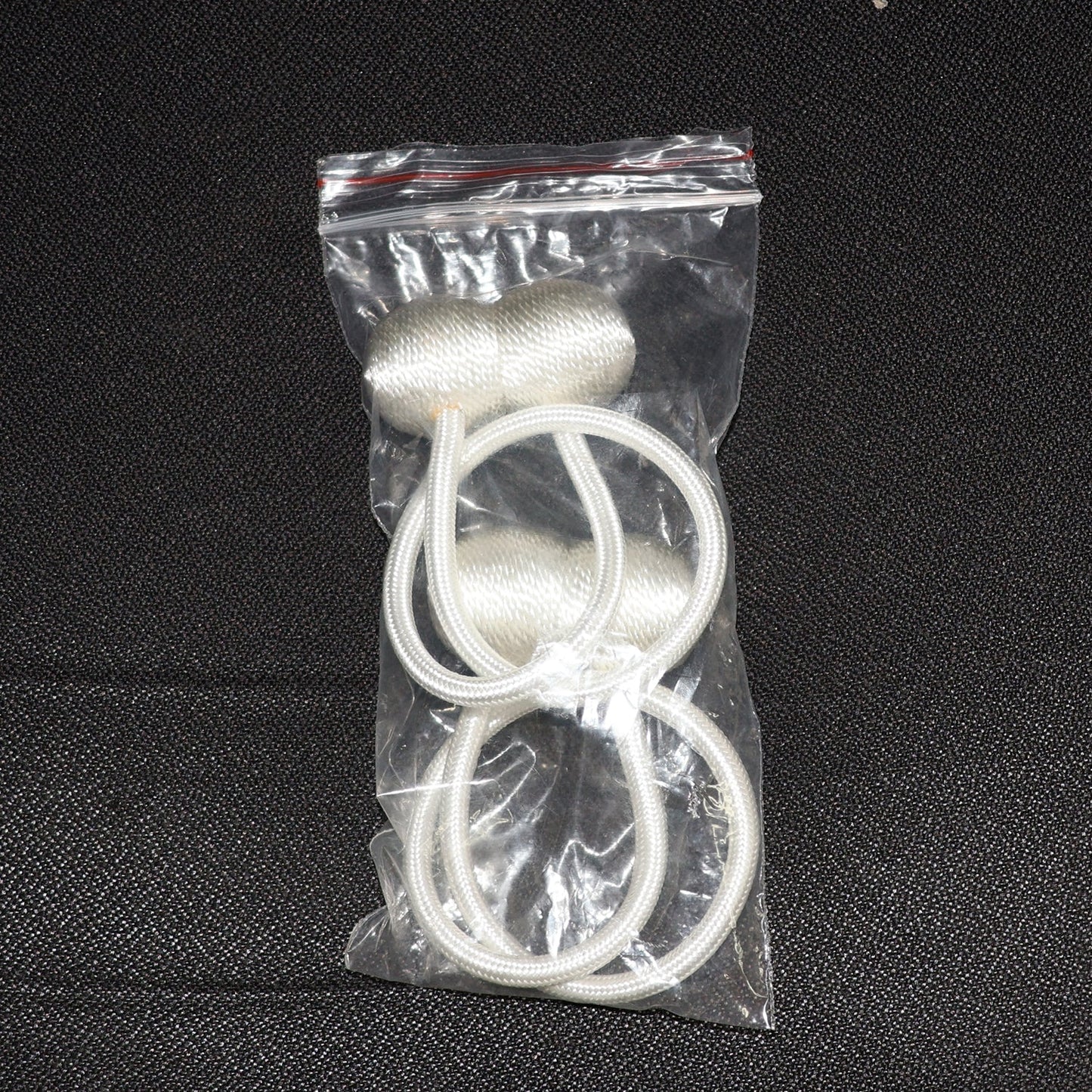 Elegant magnetic curtain tiebacks in a home setting, styling a window.