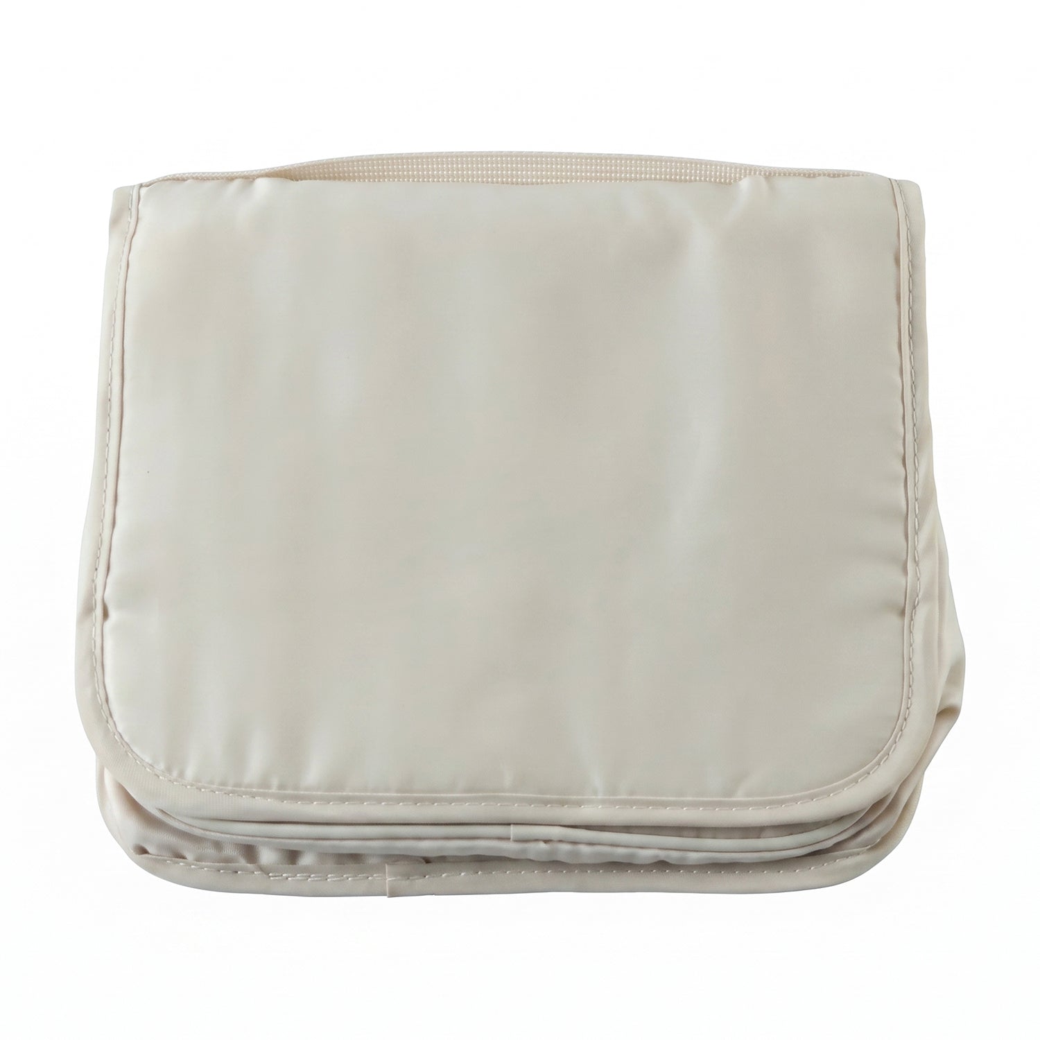 A neatly folded rectangular beige toiletry bag with a handle on a plain white background.