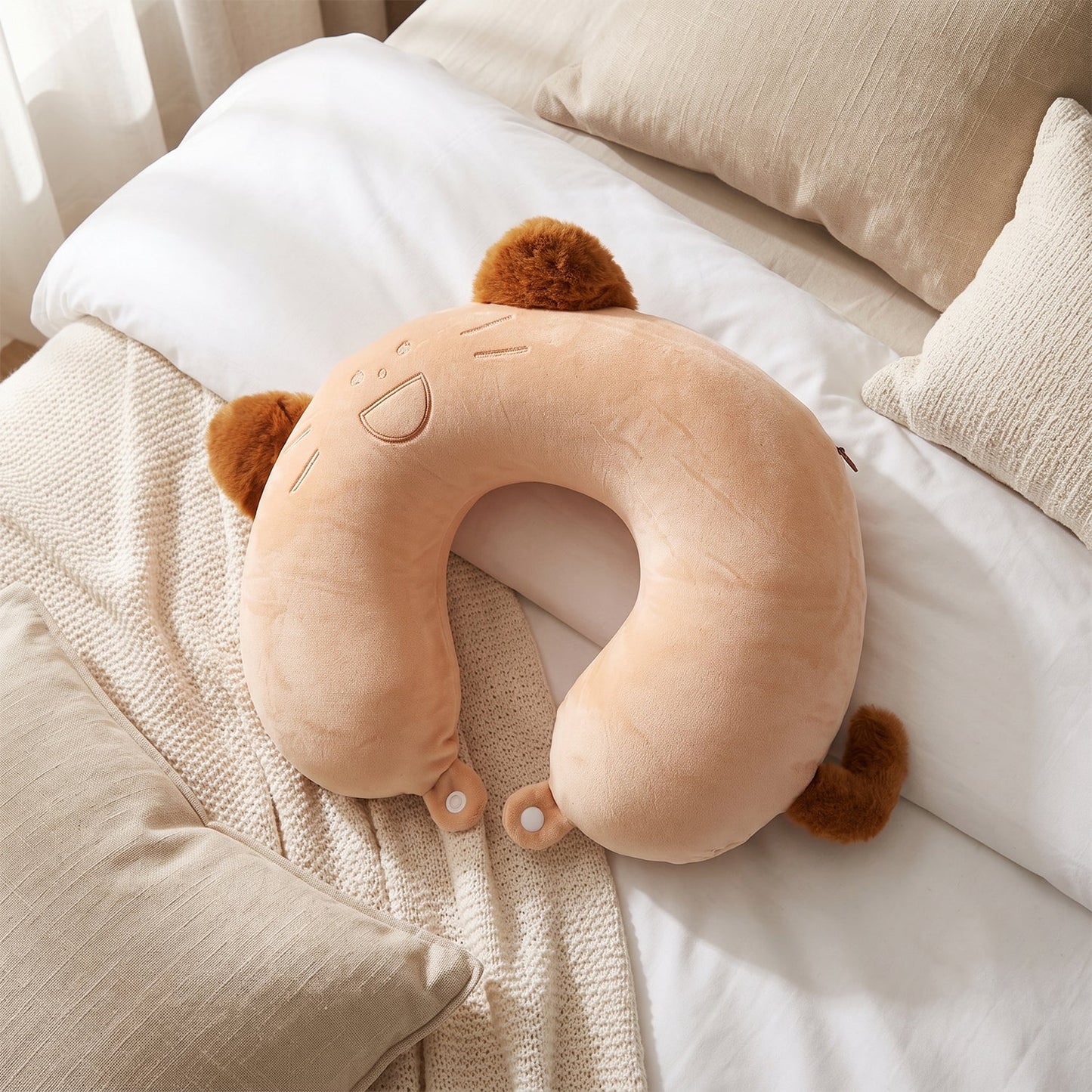 Plush kitty travel cushion for napping on journeys