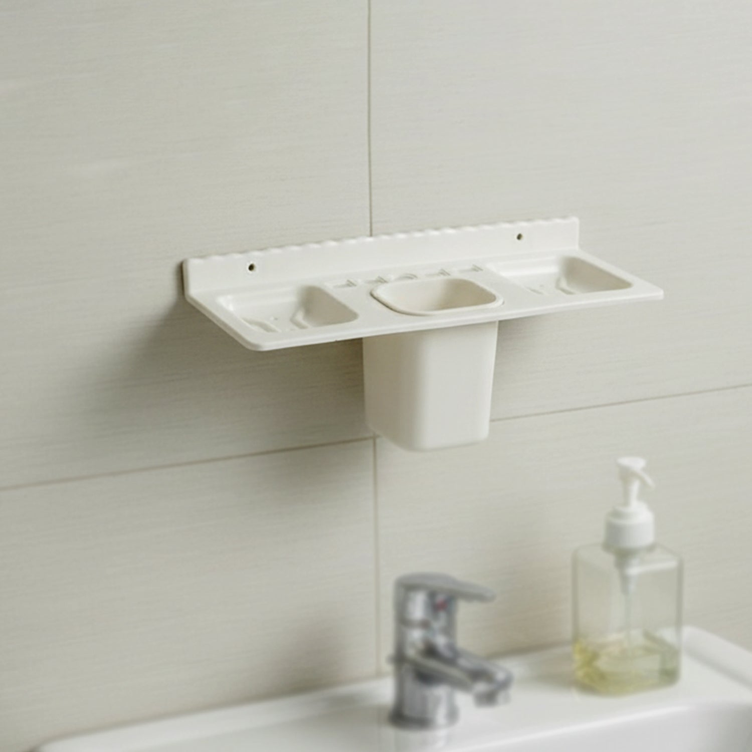 Close-up view of the detachable tumbler and toothbrush slots in the organizer.
