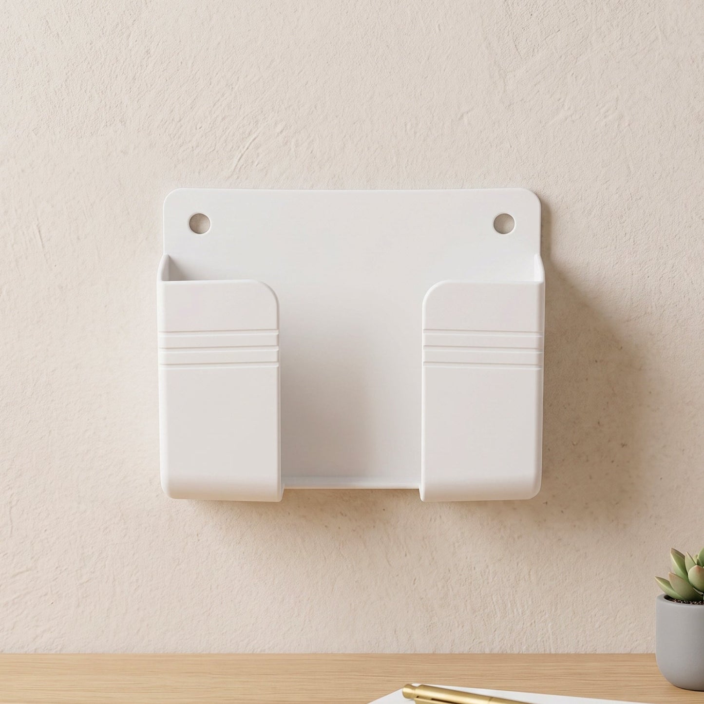 Phone holder mounted beside a wall socket