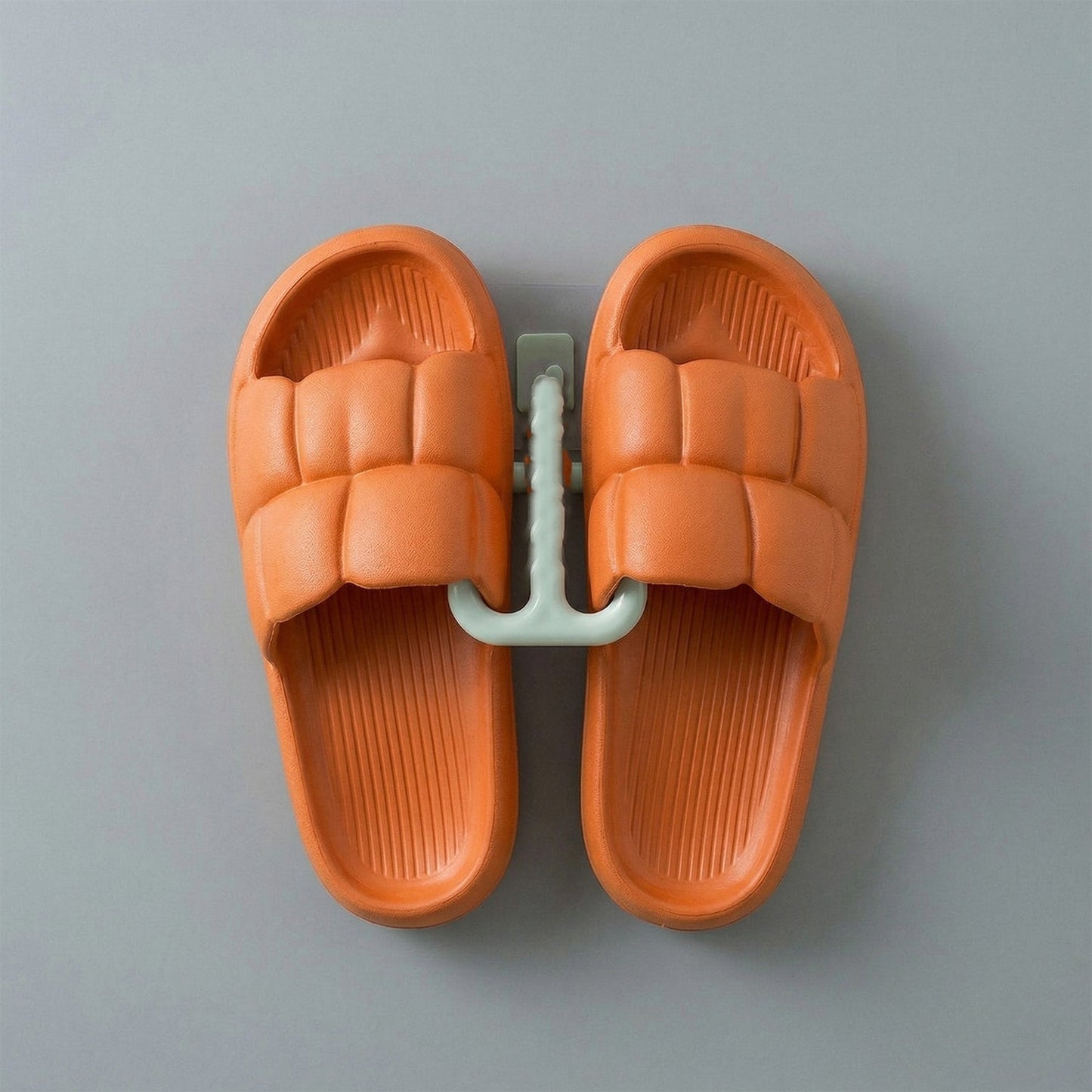 Wall mounted slipper holder in bathroom setting