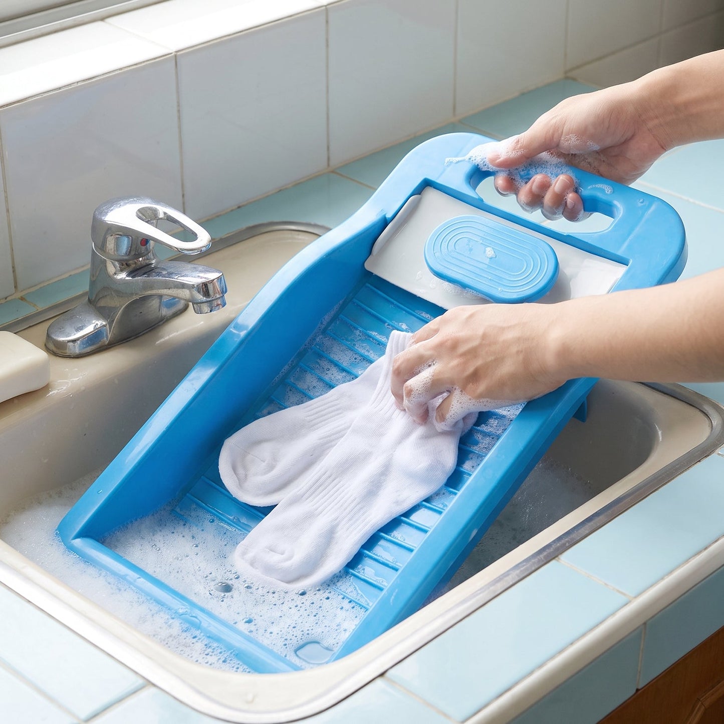 Soap holder compartment on the washing board
