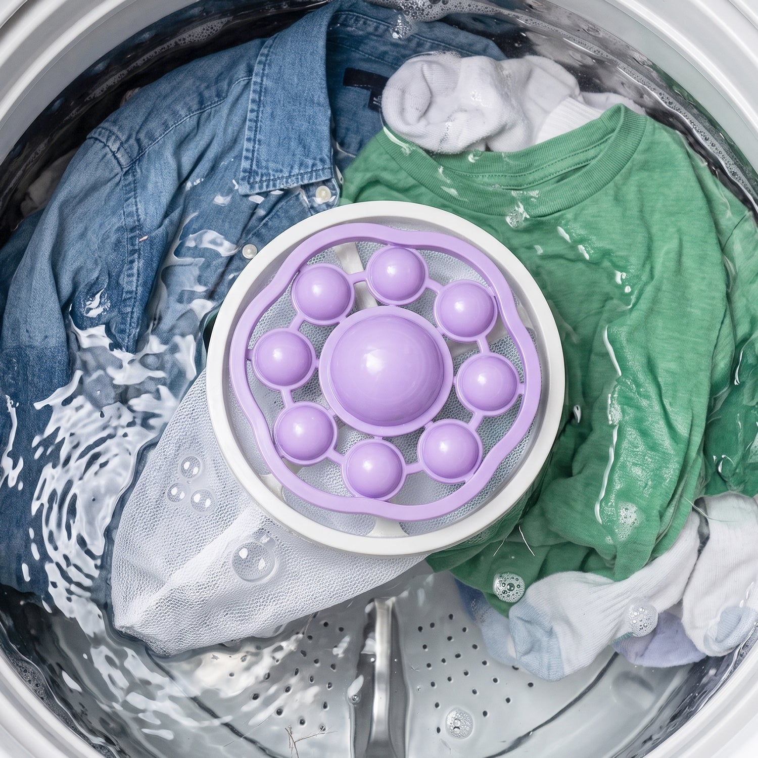 Purple and white floating lint catcher mesh bag for washing machine