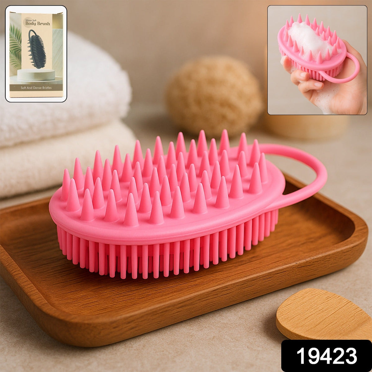 A pink silicone body brush with spiky bristles rests on a wooden tray, with an inset image showing it in use and a product