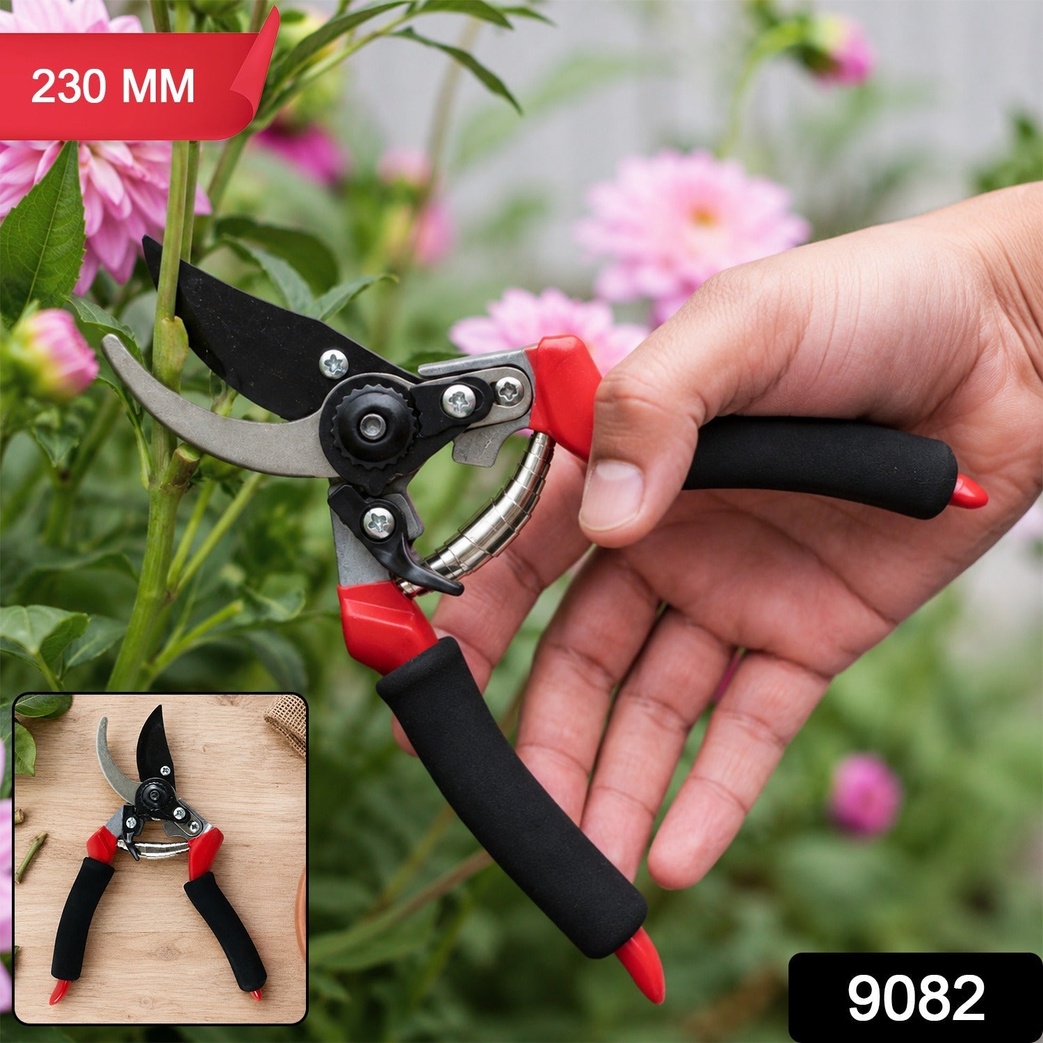 A hand holds red and black pruning shears to cut a pink dahlia stem, with an inset showing the shears on wood.
