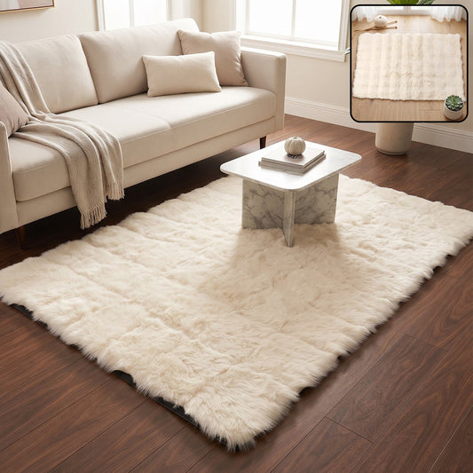 A cream fluffy faux fur rug on a wooden floor in a living room with a sofa and coffee table.