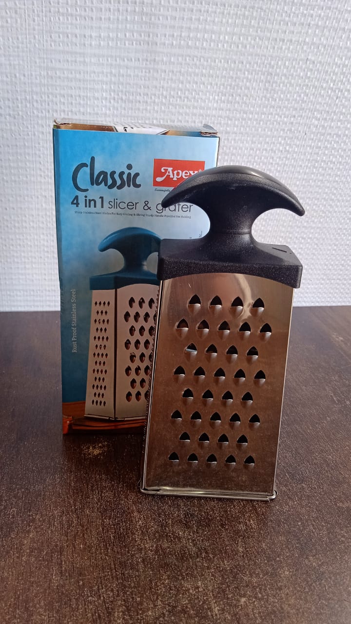 Close-up of stainless steel blades on 4-in-1 kitchen grater and slicer