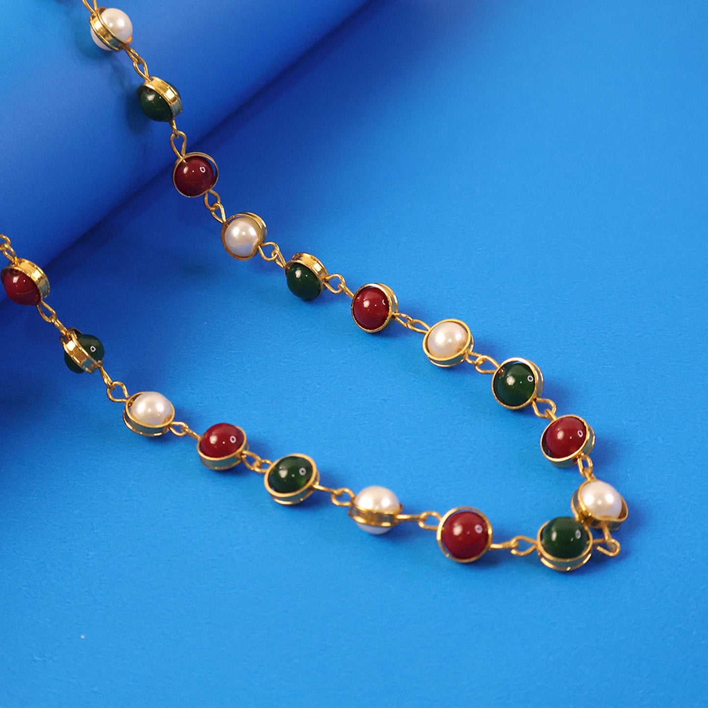 Pearl and stone necklace with gold finish chain showcasing ethnic design
