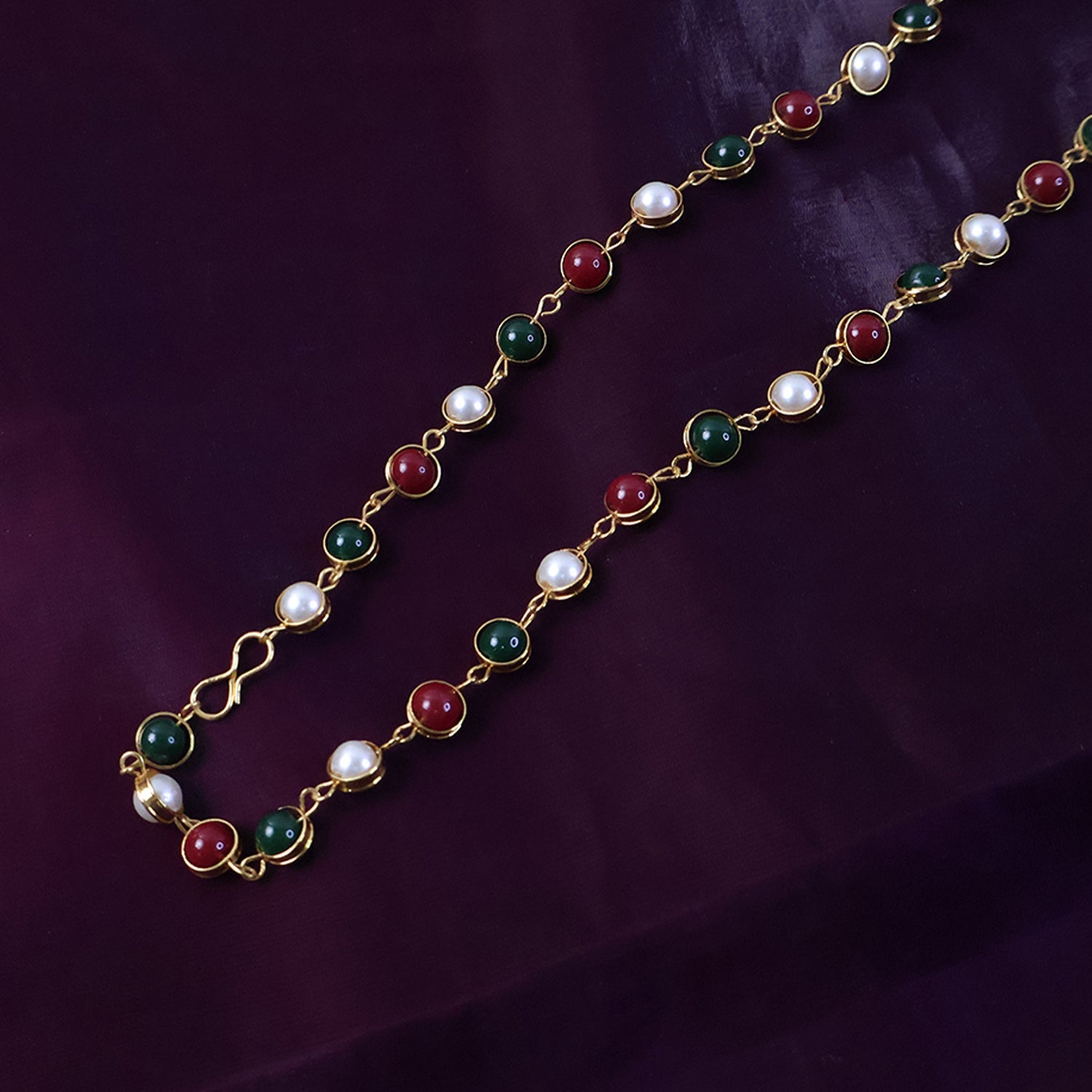 Indian style beaded jewelry necklace with red, green stones and pearl beads