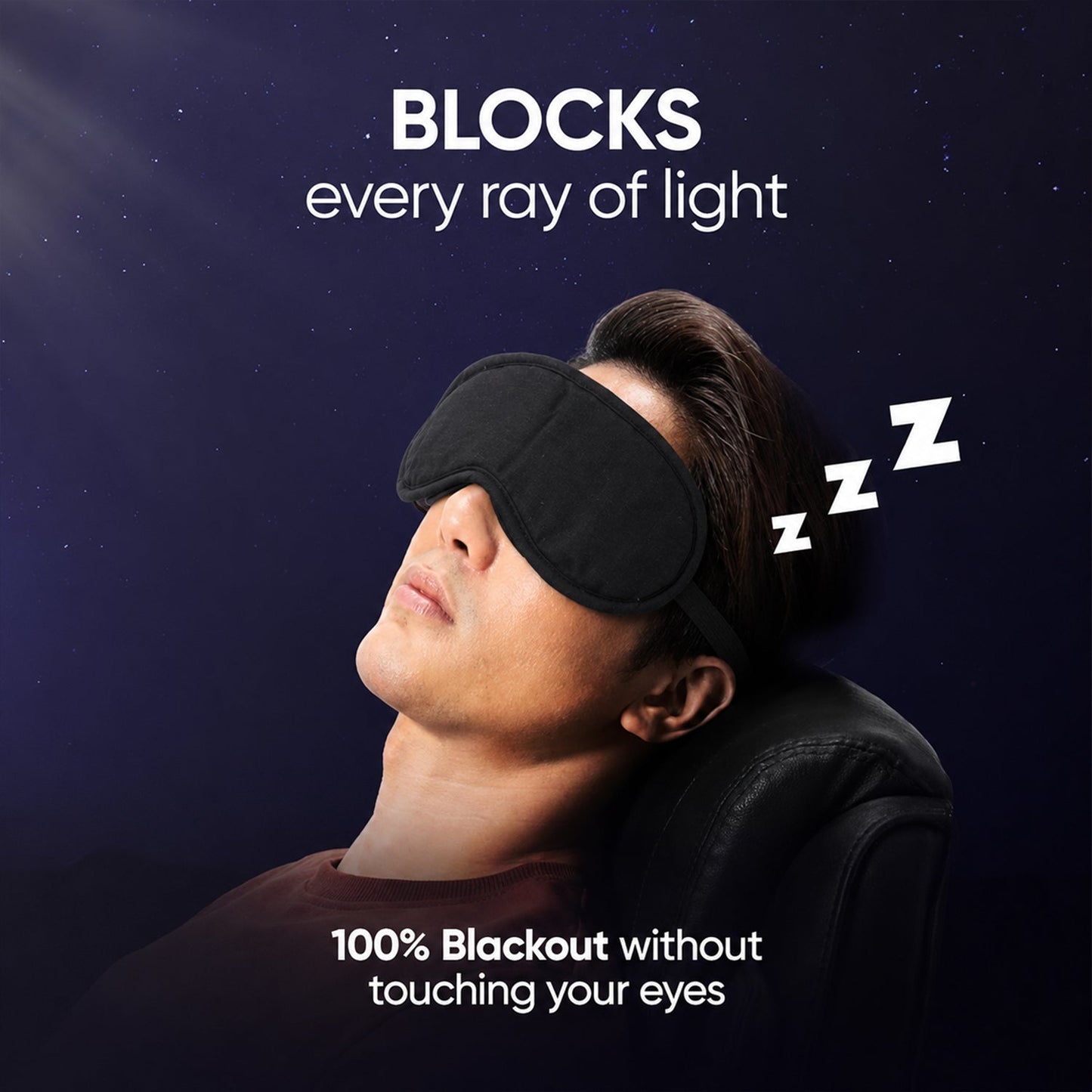 A man with dark hair sleeps in a reclined chair, wearing a black fabric mask, with Zzz icons floating above his head.