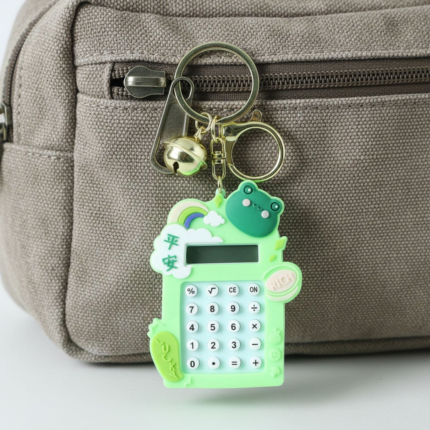 Digital calculator keychain featuring frog cartoon design and key ring