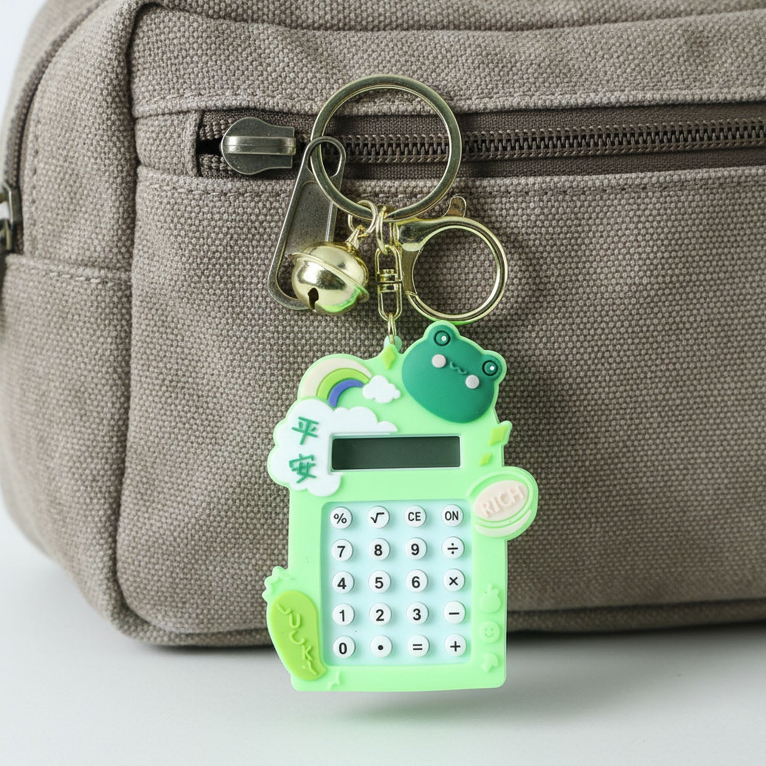 Digital calculator keychain featuring frog cartoon design and key ring