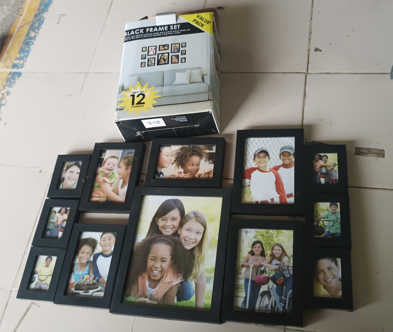 Close view of black photo frame set protecting artwork with acrylic fronts
