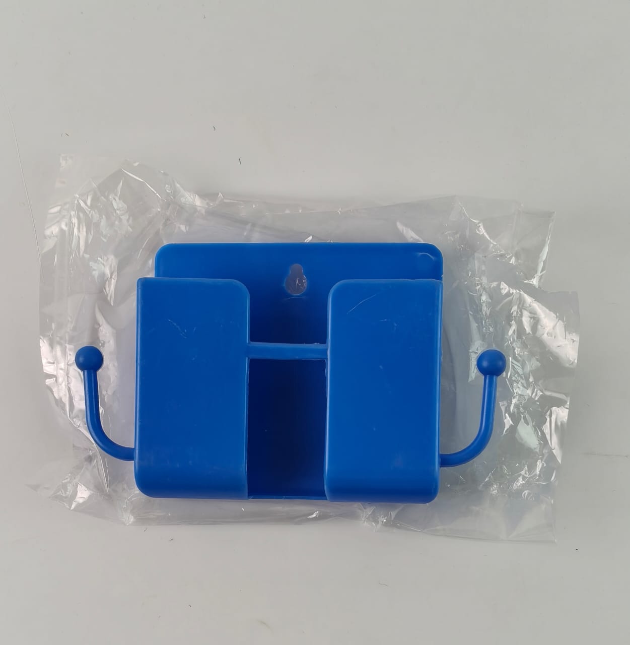 Blue plastic wall mount mobile stand in home setting