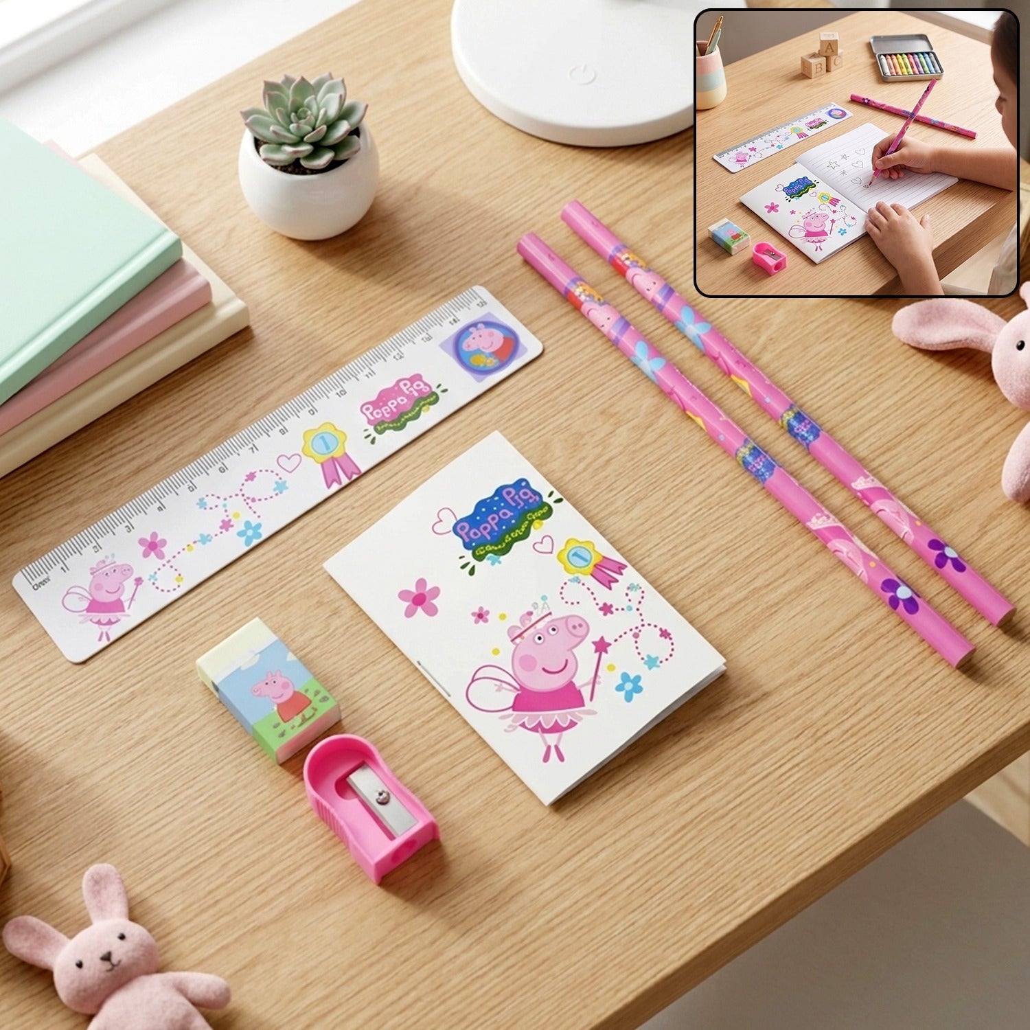A Peppa Pig stationery set with pencils, ruler, eraser, sharpener, and notebook on a wooden desk.