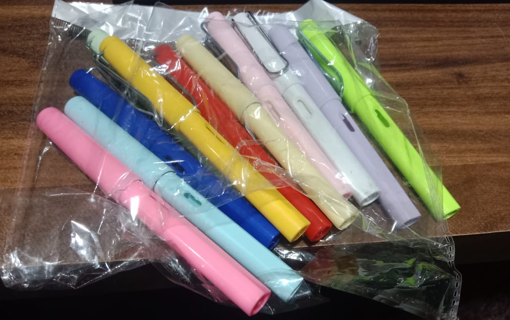 Everlasting magic pencil with replaceable eraser displayed with writing samples and accessories.