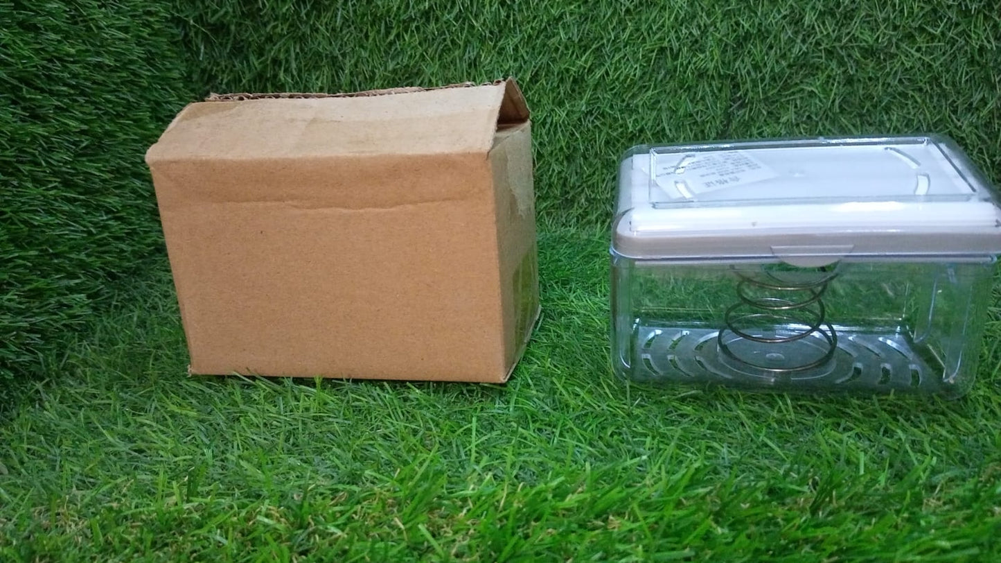 Clear plastic soap dispenser with rollers placed on kitchen countertop