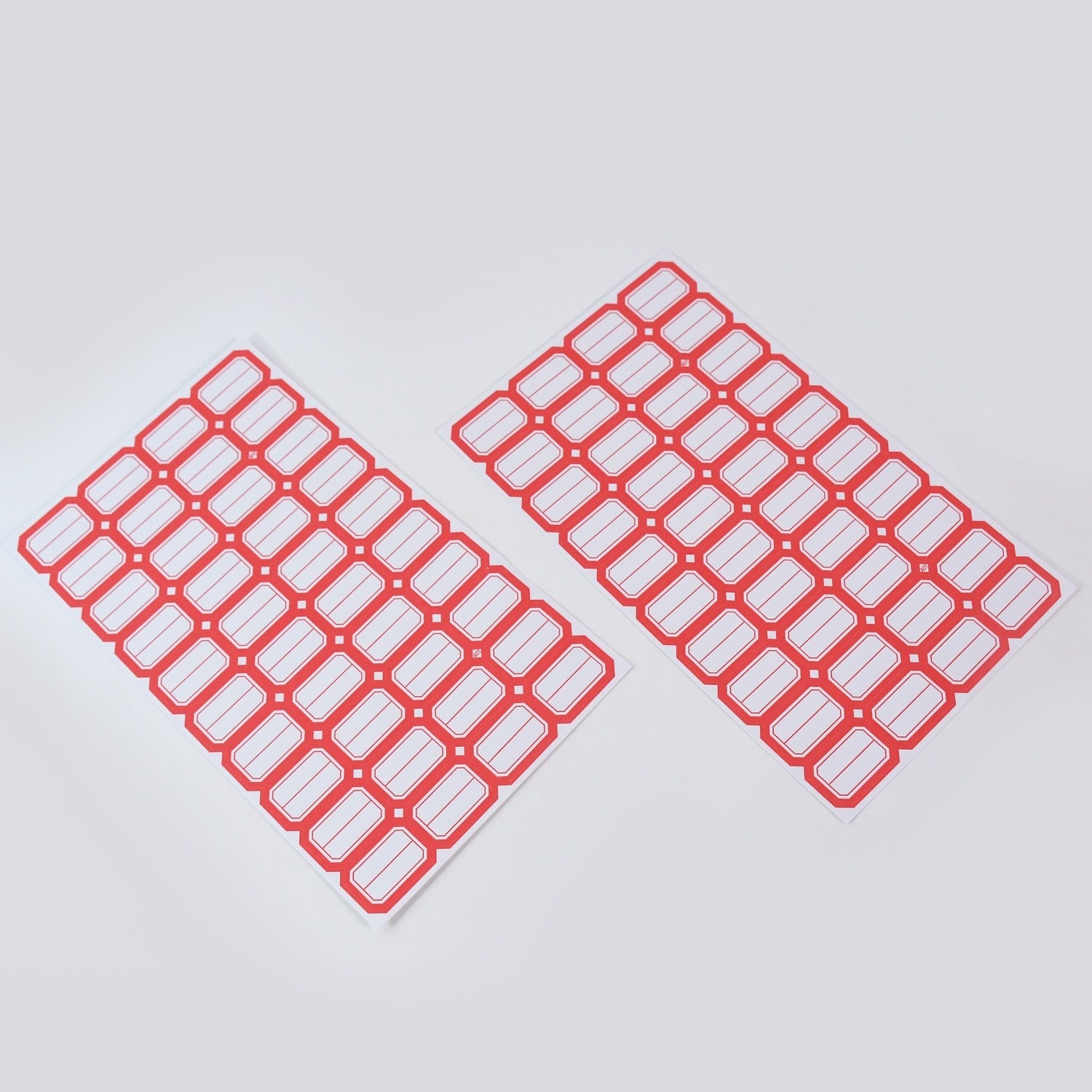 Closeup of writable blank label sticker sheet with red border