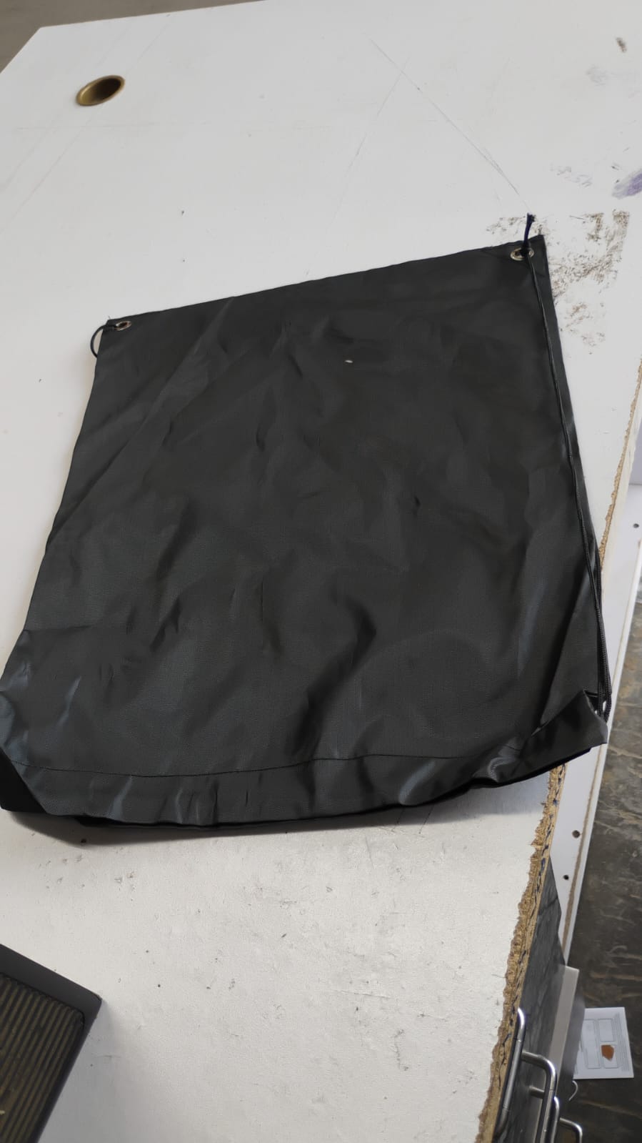 Varied mix colors and designs of the foldable water-resistant nylon drawstring backpacks.