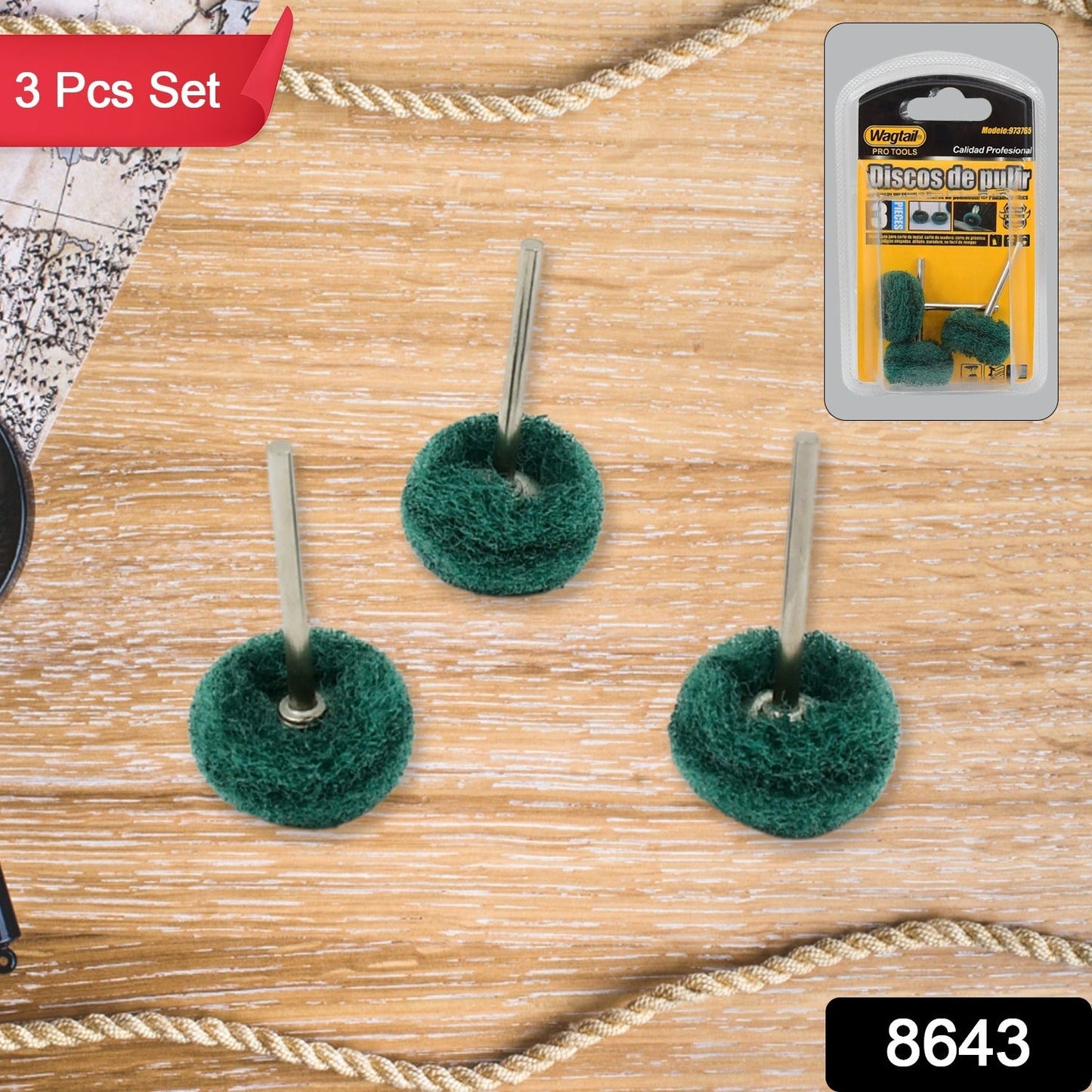 Three green polishing wheels with metal shanks on a wooden background with a rope border