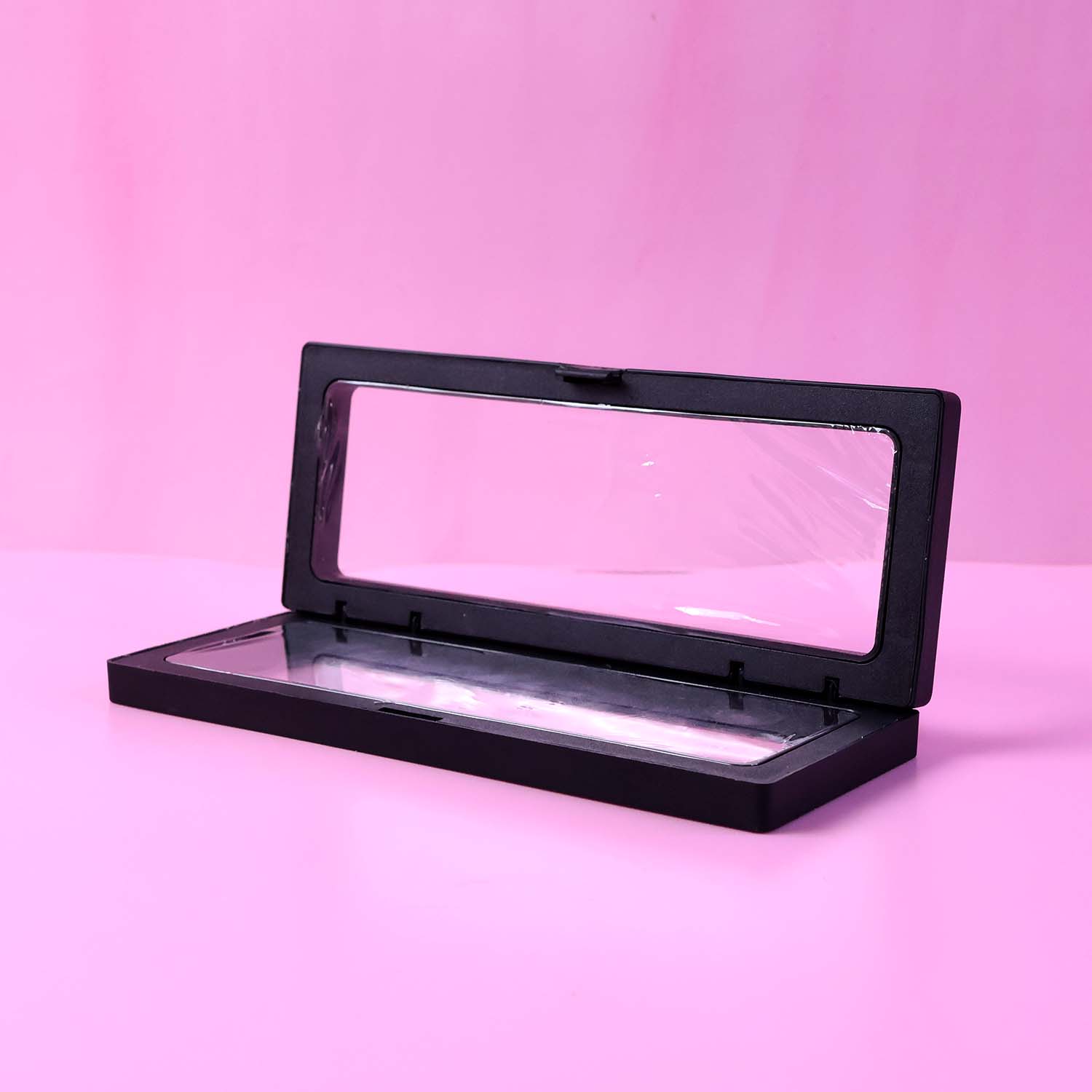 Closed top view of transparent floating jewelry display box 18x7 cm with secure magnetic lock