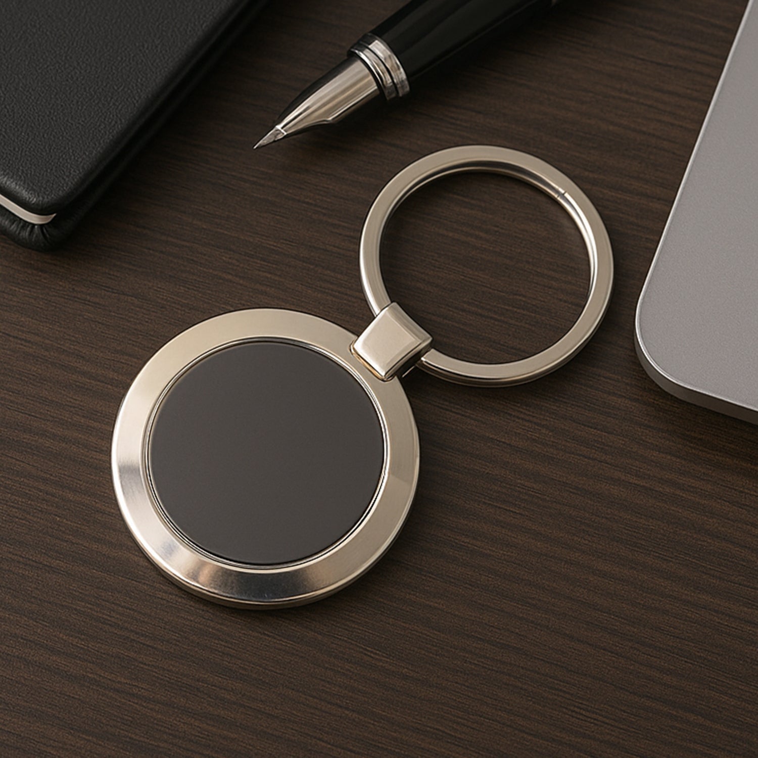 Durable round metal keychain with strong alloy build and black center.
